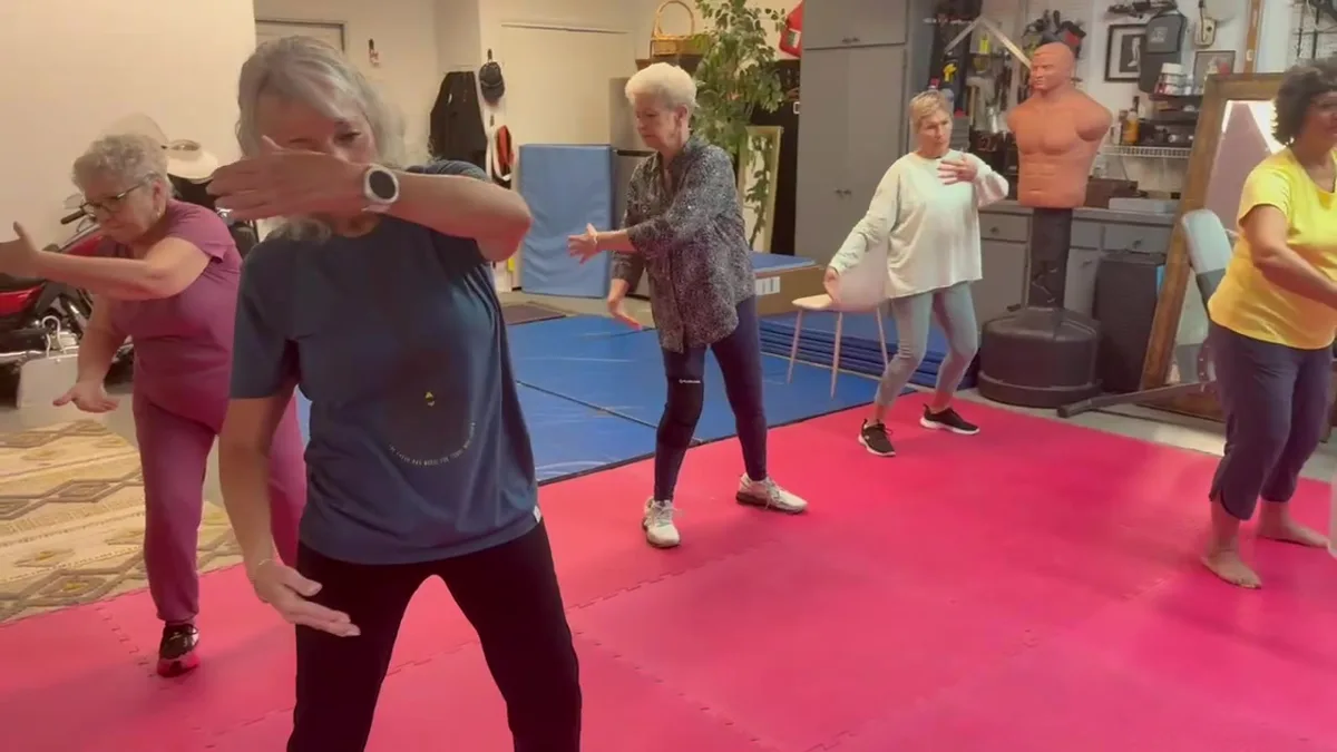 Older adults practicing gentle Tai Chi Qi Gong together in Heath, shown on the Fate page