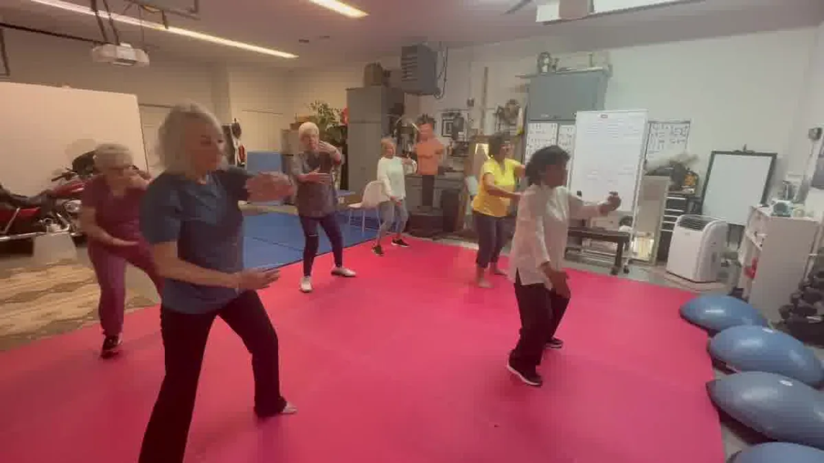 Older adults practicing gentle Tai Chi Qi Gong together in Heath, shown on the Forney page